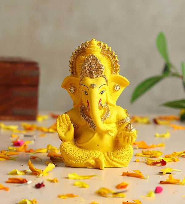 Idol: yellow and gold polyresin Lord Ganesha