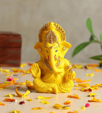 Idol: yellow and gold polyresin Lord Ganesha