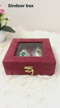 Idol: ornate leaf-shaped kumkum or sindoor box (sindoor dani)