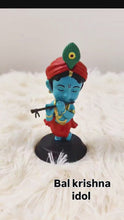 Idol: Lord Krishna playing the flute